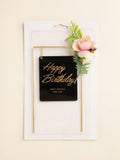 Black and Gold Hanging Sign "Happy Birthday" Cake Topper with Floral Accent